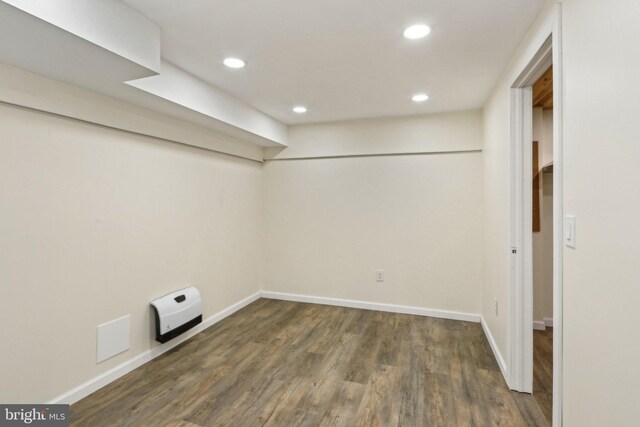 finished basement with recessed lighting, baseboards, and wood finished floors