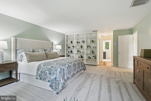 bedroom featuring light colored carpet