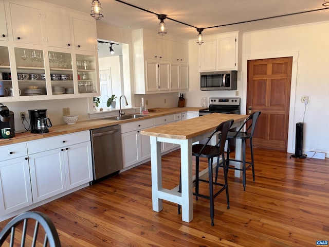 3716 Etlan Rd, Etlan, VA 22719 - kitchen with appliances with stainless steel finishes, a sink, white cabinetry, and butcher block countertops