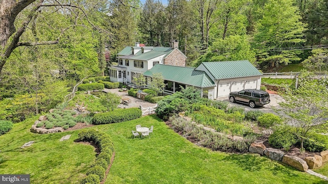 view of subject property with a heavily wooded area