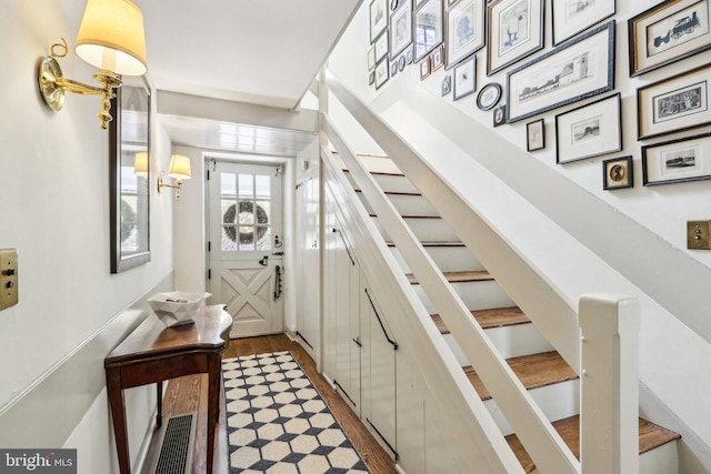 stairs with wood finished floors