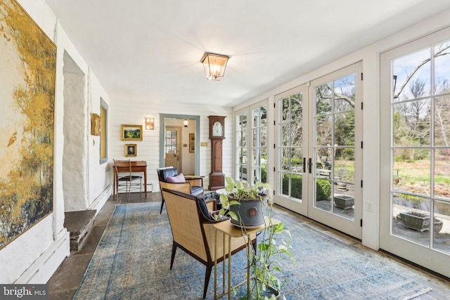 sunroom / solarium featuring french doors