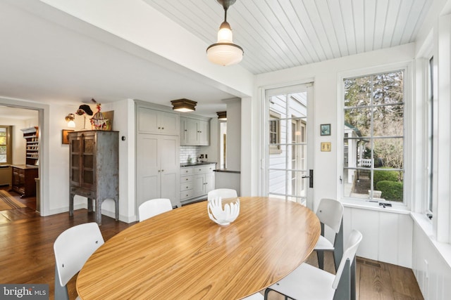 dining area with wood finished floors