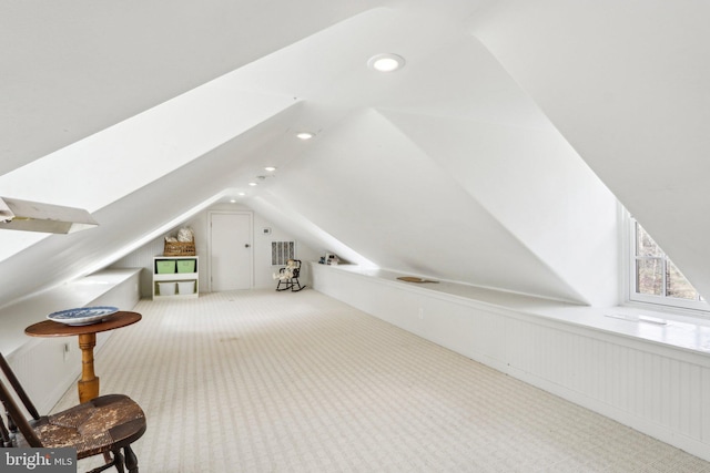 additional living space with carpet floors, lofted ceiling, a wainscoted wall, and recessed lighting