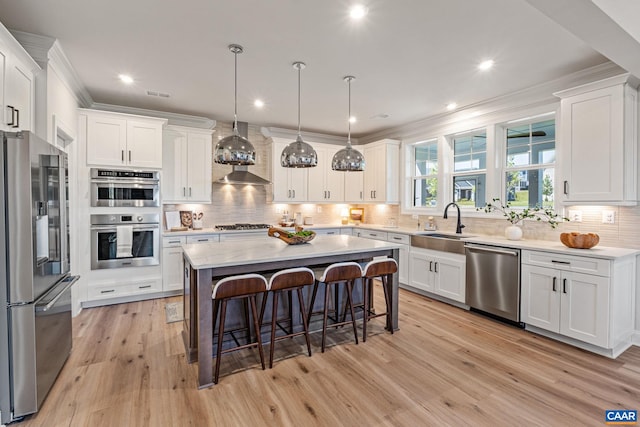 13A Sablewood Dr, Charlottesville, VA 22911 - kitchen with white cabinets, a breakfast bar, a sink, and stainless steel appliances