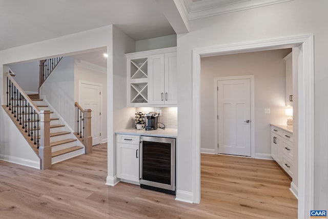13A Sablewood Dr, Charlottesville, VA 22911 - bar with a dry bar, stairs, wine cooler, and light wood-style floors
