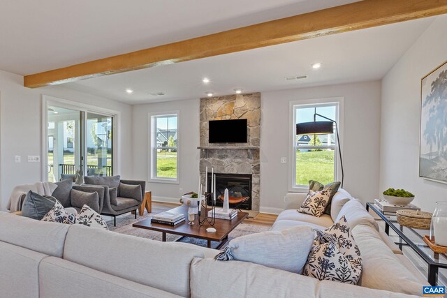 13A Sablewood Dr, Charlottesville, VA 22911 - living area featuring baseboards, beam ceiling, visible vents, a fireplace, and wood finished floors