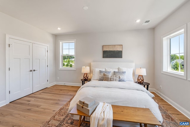 13A Sablewood Dr, Charlottesville, VA 22911 - bedroom with light wood-style flooring, multiple windows, and visible vents