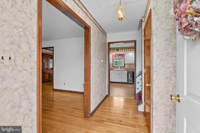 30 Stardust Dr, Newark, DE 19702 - corridor featuring light wood-type flooring, a sink, and baseboards