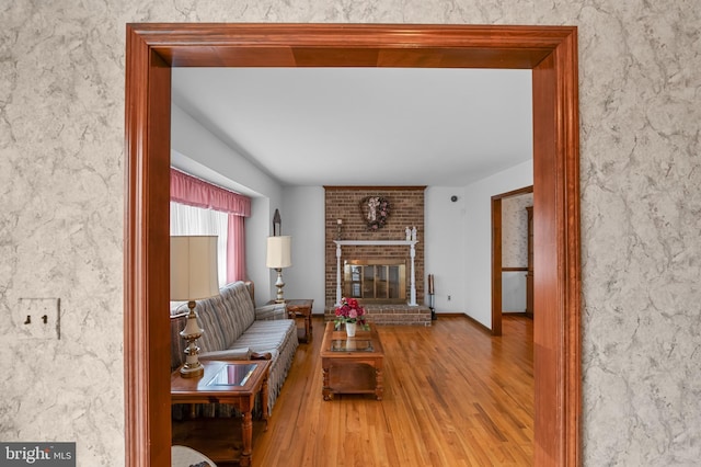 30 Stardust Dr, Newark, DE 19702 - living room with wood finished floors and a brick fireplace