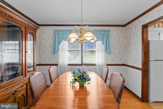 30 Stardust Dr, Newark, DE 19702 - dining space with wallpapered walls, a chandelier, light wood-style flooring, and ornamental molding