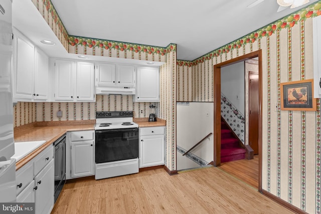 30 Stardust Dr, Newark, DE 19702 - kitchen featuring electric range oven, wallpapered walls, light wood-type flooring, light countertops, and white cabinets