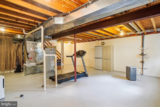 unfinished basement with heating unit and water heater