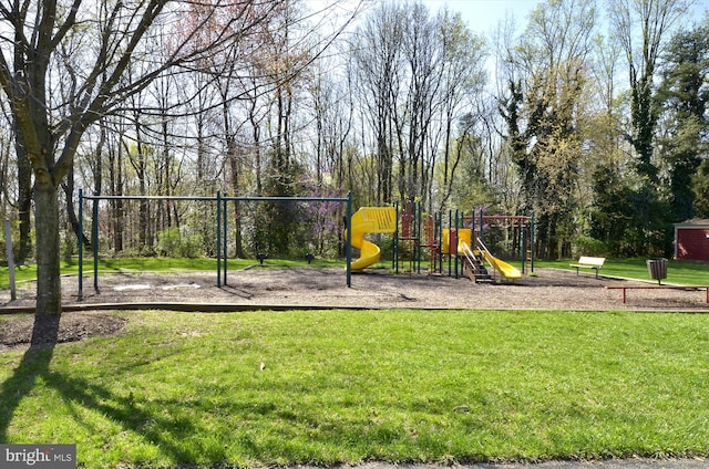 communal playground featuring a yard