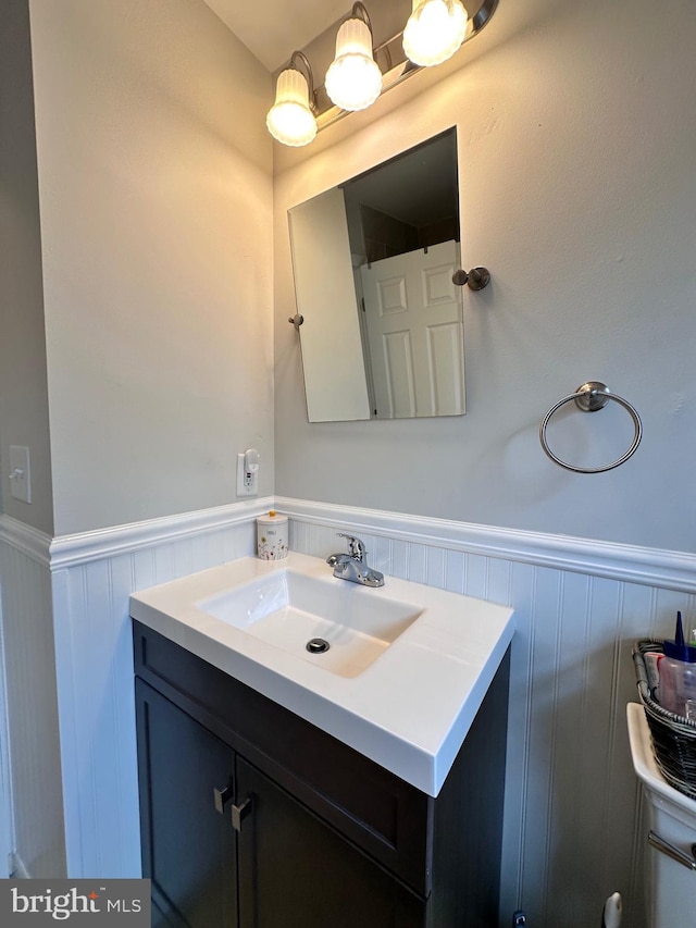bathroom with wainscoting and vanity