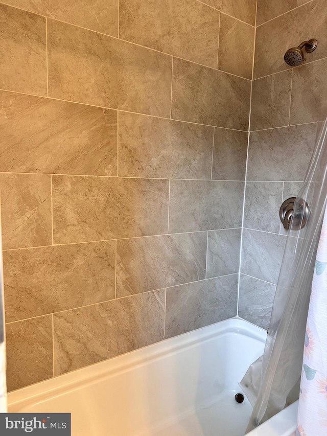 full bathroom with shower / bath combo
