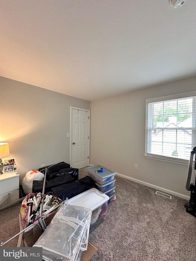 interior space featuring baseboards and visible vents