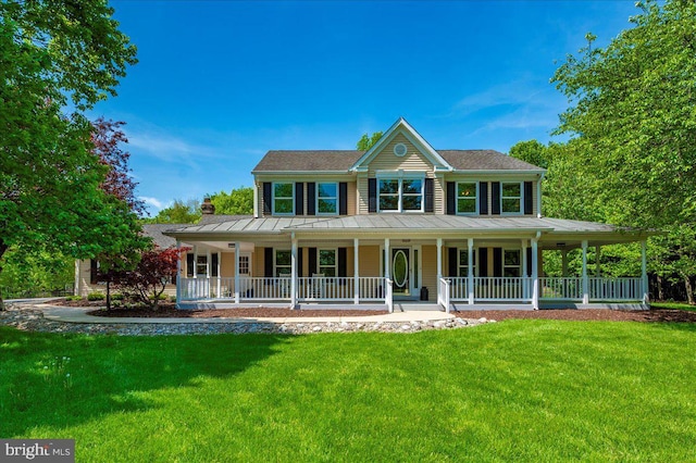 8412 Dasher Ct, Gaithersburg, MD 20882 - view of front of property with a standing seam roof, covered porch, a front lawn, and metal roof