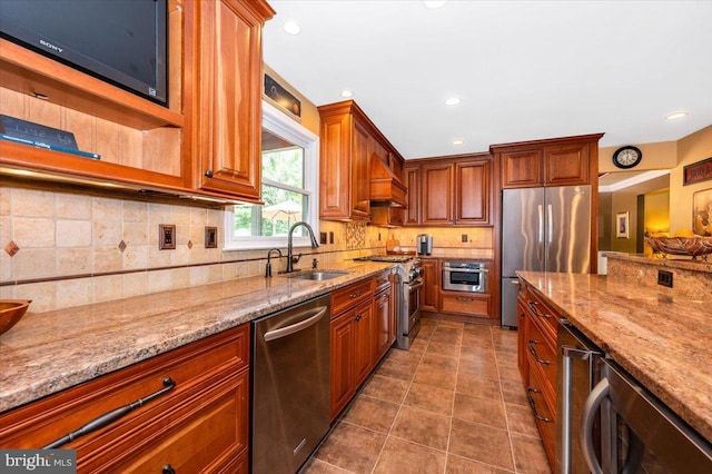 8412 Dasher Ct, Gaithersburg, MD 20882 - kitchen with appliances with stainless steel finishes, a sink, light stone countertops, decorative backsplash, and recessed lighting