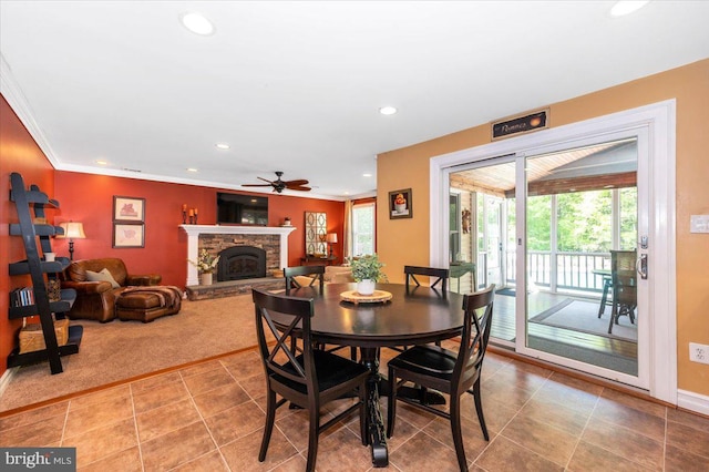 8412 Dasher Ct, Gaithersburg, MD 20882 - tiled dining room with healthy amount of natural light, a ceiling fan, recessed lighting, a fireplace, and baseboards