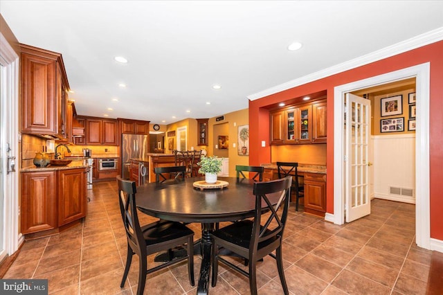 8412 Dasher Ct, Gaithersburg, MD 20882 - dining area featuring recessed lighting, tile patterned flooring, and crown molding