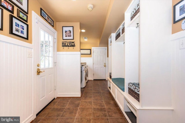 8412 Dasher Ct, Gaithersburg, MD 20882 - mudroom featuring washer and dryer and a wainscoted wall