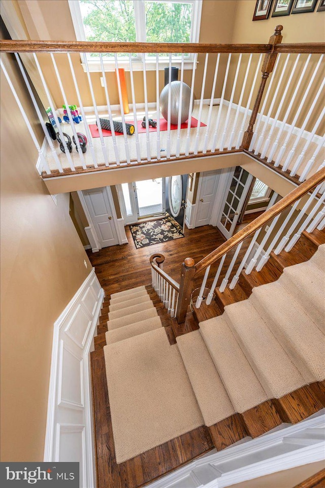 8412 Dasher Ct, Gaithersburg, MD 20882 - stairway featuring wood finished floors