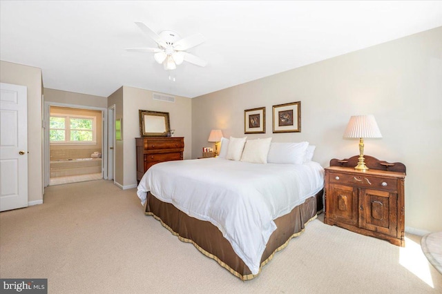 8412 Dasher Ct, Gaithersburg, MD 20882 - bedroom featuring light colored carpet, baseboards, connected bathroom, and a ceiling fan