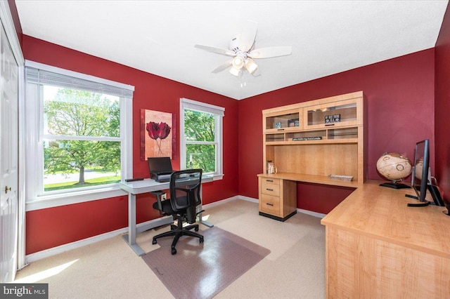 8412 Dasher Ct, Gaithersburg, MD 20882 - home office featuring light colored carpet, ceiling fan, baseboards, and built in desk