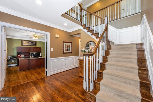 8412 Dasher Ct, Gaithersburg, MD 20882 - stairway with crown molding, a decorative wall, wood finished floors, a ceiling fan, and recessed lighting