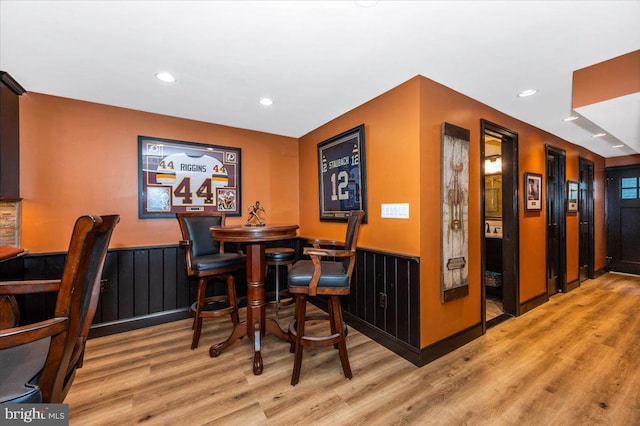 8412 Dasher Ct, Gaithersburg, MD 20882 - bar featuring wood finished floors, recessed lighting, and a wainscoted wall