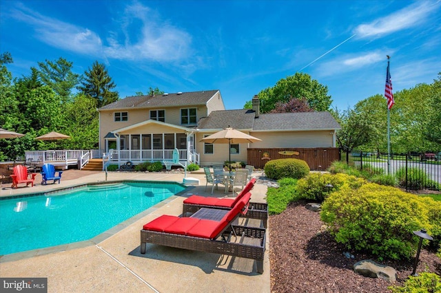 8412 Dasher Ct, Gaithersburg, MD 20882 - view of pool featuring a sunroom, fence, a patio area, and a deck