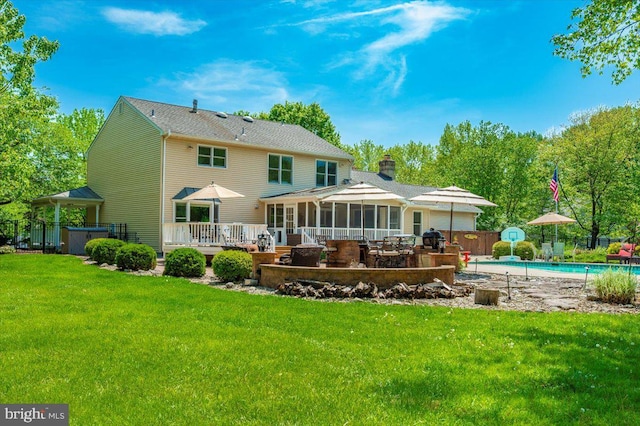 8412 Dasher Ct, Gaithersburg, MD 20882 - back of house with a hot tub, a chimney, a sunroom, a patio, and a deck