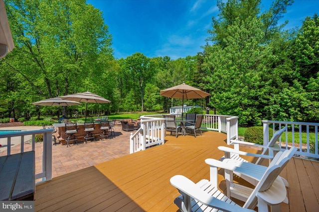8412 Dasher Ct, Gaithersburg, MD 20882 - wooden deck with outdoor dining area, an outdoor pool, and a patio