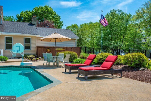 8412 Dasher Ct, Gaithersburg, MD 20882 - view of pool featuring a patio area, fence, and outdoor dining space