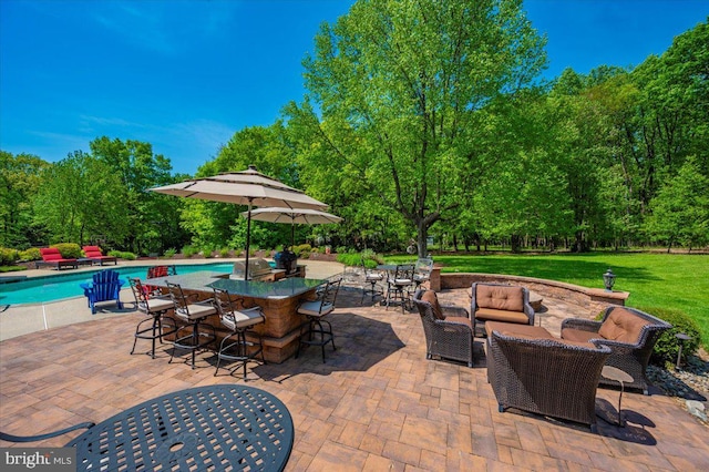8412 Dasher Ct, Gaithersburg, MD 20882 - view of patio with an outdoor hangout area, an outdoor pool, and view of wooded area