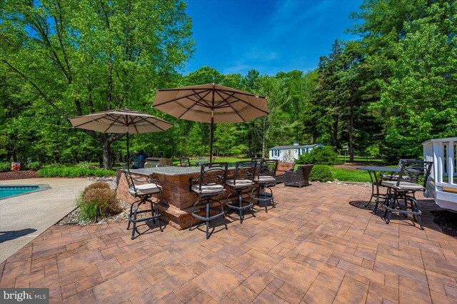 8412 Dasher Ct, Gaithersburg, MD 20882 - view of patio featuring an outdoor pool