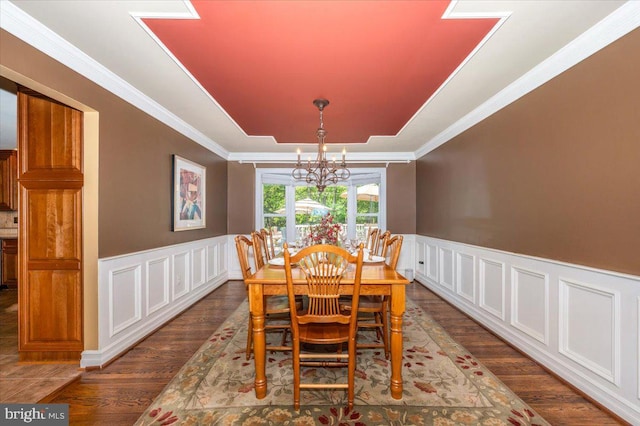 8412 Dasher Ct, Gaithersburg, MD 20882 - dining area with wood finished floors, a chandelier, a decorative wall, wainscoting, and crown molding