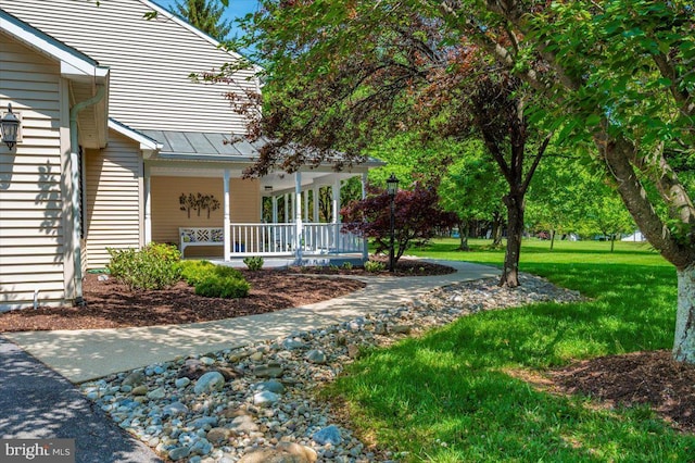8412 Dasher Ct, Gaithersburg, MD 20882 - entrance to property with covered porch, a standing seam roof, metal roof, and a lawn