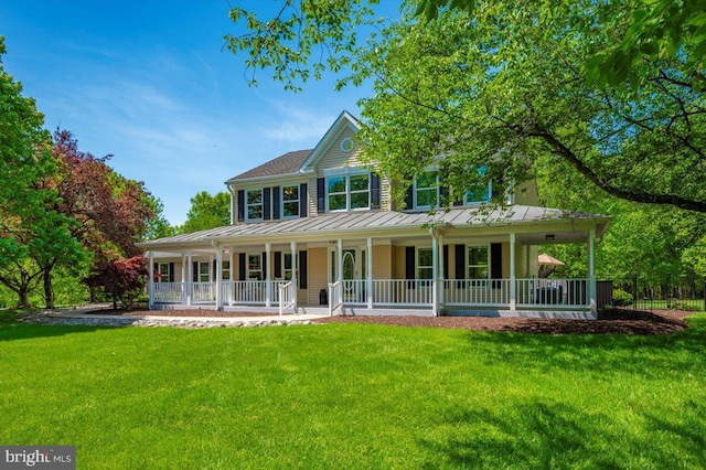 8412 Dasher Ct, Gaithersburg, MD 20882 - view of front of house with a standing seam roof, covered porch, a front lawn, and metal roof