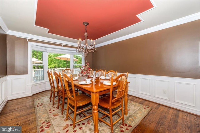8412 Dasher Ct, Gaithersburg, MD 20882 - dining area with a chandelier, ornamental molding, wood finished floors, and a wainscoted wall