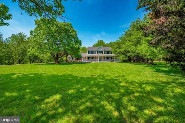 8412 Dasher Ct, Gaithersburg, MD 20882 - view of grassy yard featuring a porch