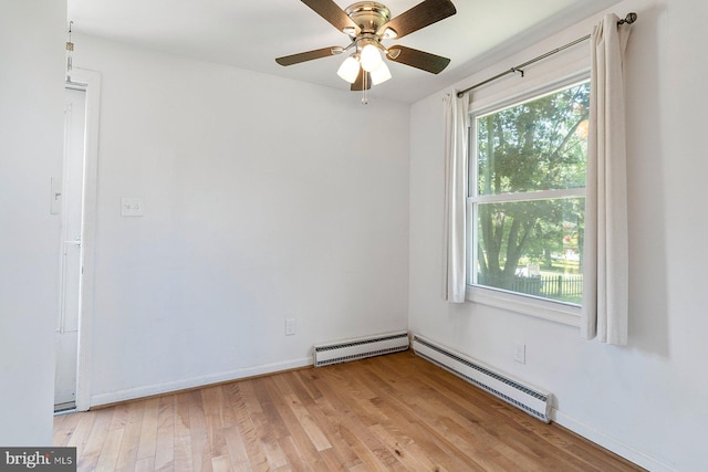 1722 Antler Ln, Finksburg, MD 21048 - empty room with a baseboard heating unit, light wood-style floors, and ceiling fan