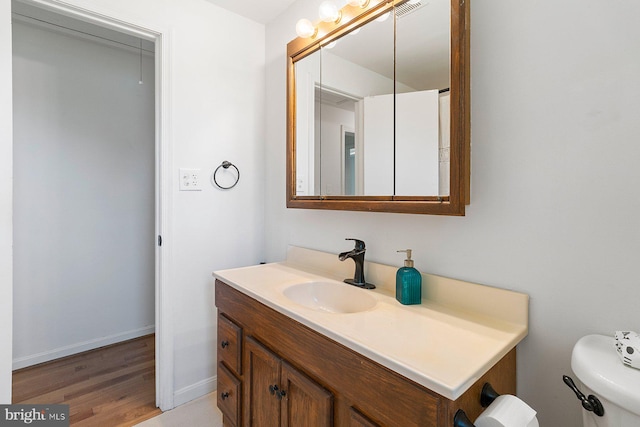 1722 Antler Ln, Finksburg, MD 21048 - bathroom featuring vanity, toilet, wood finished floors, and baseboards