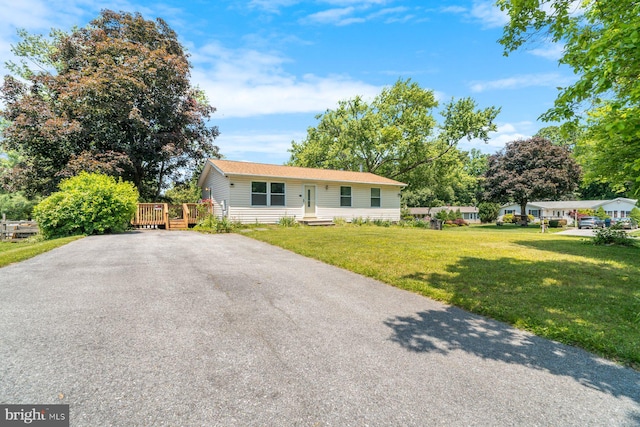 1722 Antler Ln, Finksburg, MD 21048 - ranch-style home with a deck, a front yard, and driveway