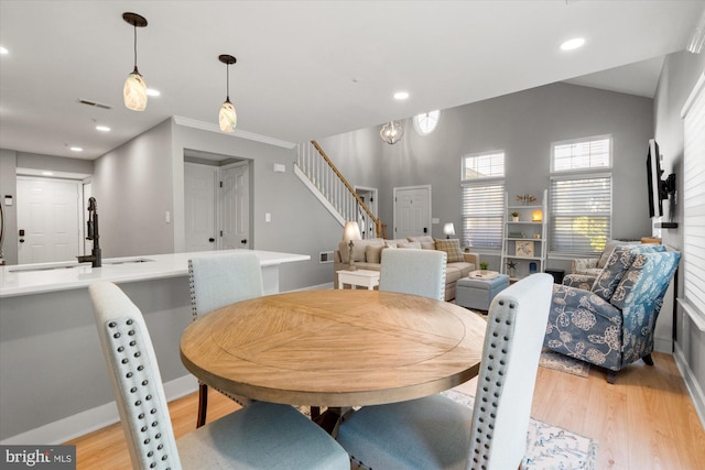 43426 Edgecliff Ter, Ashburn, VA 20147 - dining area featuring stairway, light wood-style floors, recessed lighting, and visible vents