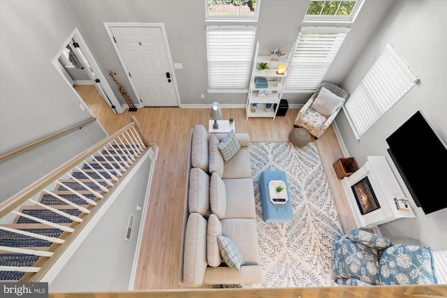 43426 Edgecliff Ter, Ashburn, VA 20147 - living room featuring baseboards and wood finished floors
