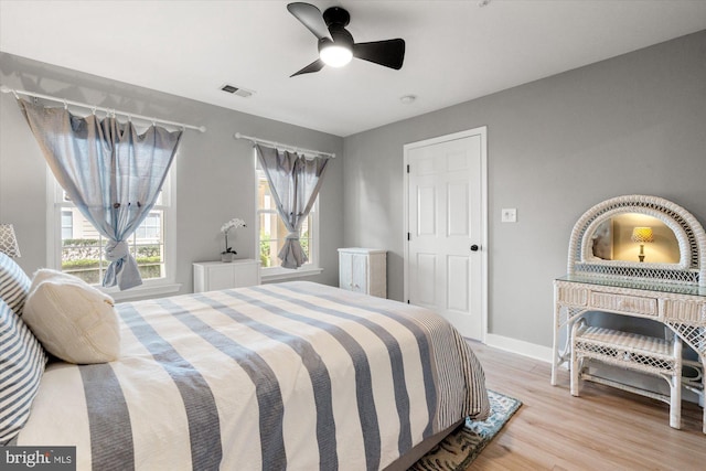 43426 Edgecliff Ter, Ashburn, VA 20147 - bedroom with baseboards, a ceiling fan, wood finished floors, and visible vents