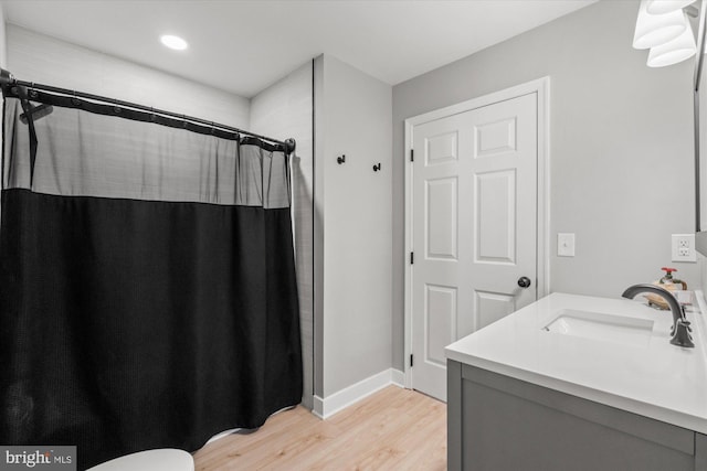 43426 Edgecliff Ter, Ashburn, VA 20147 - bathroom featuring vanity, recessed lighting, baseboards, wood finished floors, and a shower with curtain