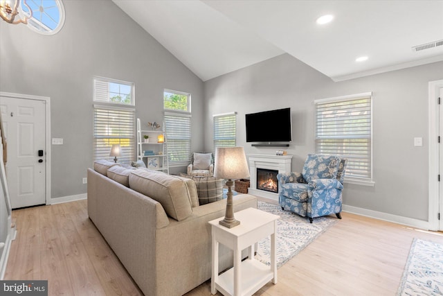 43426 Edgecliff Ter, Ashburn, VA 20147 - living area featuring high vaulted ceiling, visible vents, baseboards, and light wood finished floors